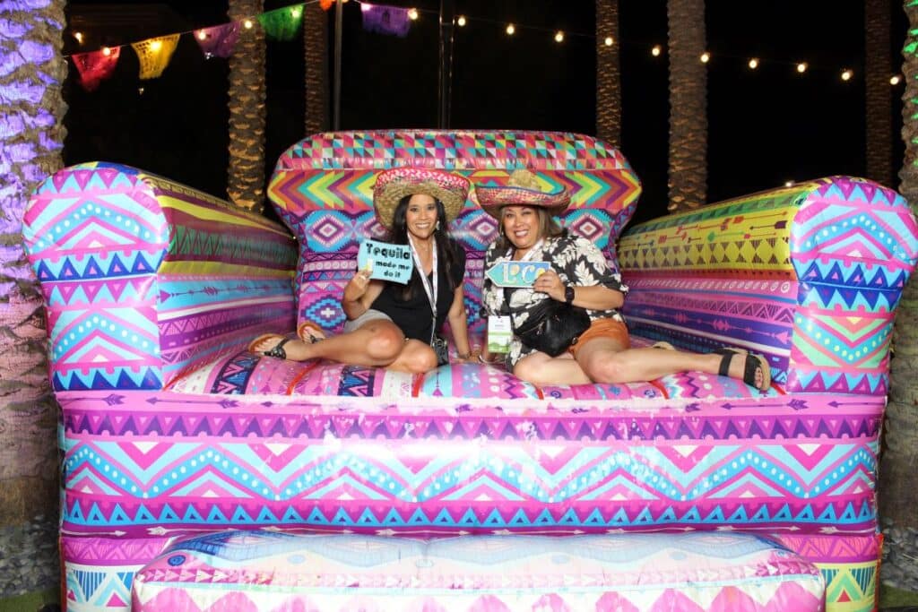 image of 2 ladies posing on a big inflatable chair
