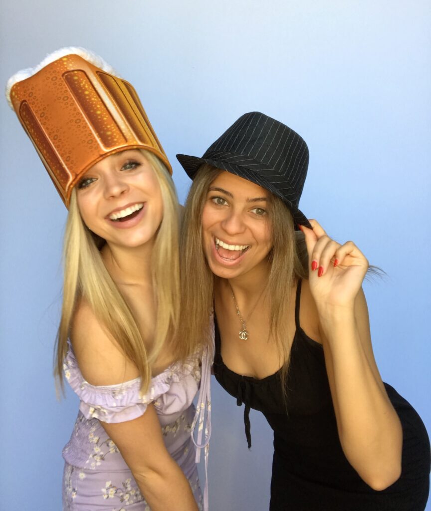 image of 2 girls posing in a photo booth