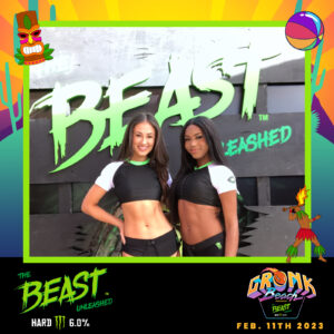 image of 2 girls posing for a photo booth at gronk beach for the beast unleashed