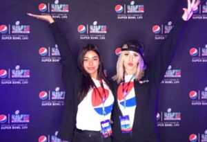 image of girls posing for a selfie booth at the pepsi watch party