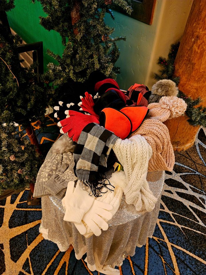 image of ski props consisting of gloves, beanies and scarves
