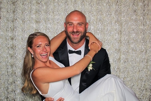 image of bride and groom posing in a photo booth