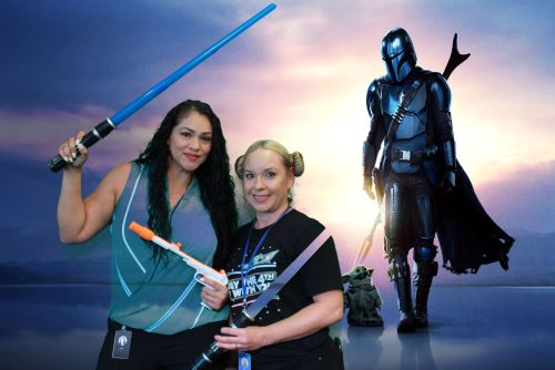 image of girls posing for a star wars backdrop using AI Green Screen